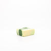 White and green colored vegan facial cleansing bar. 