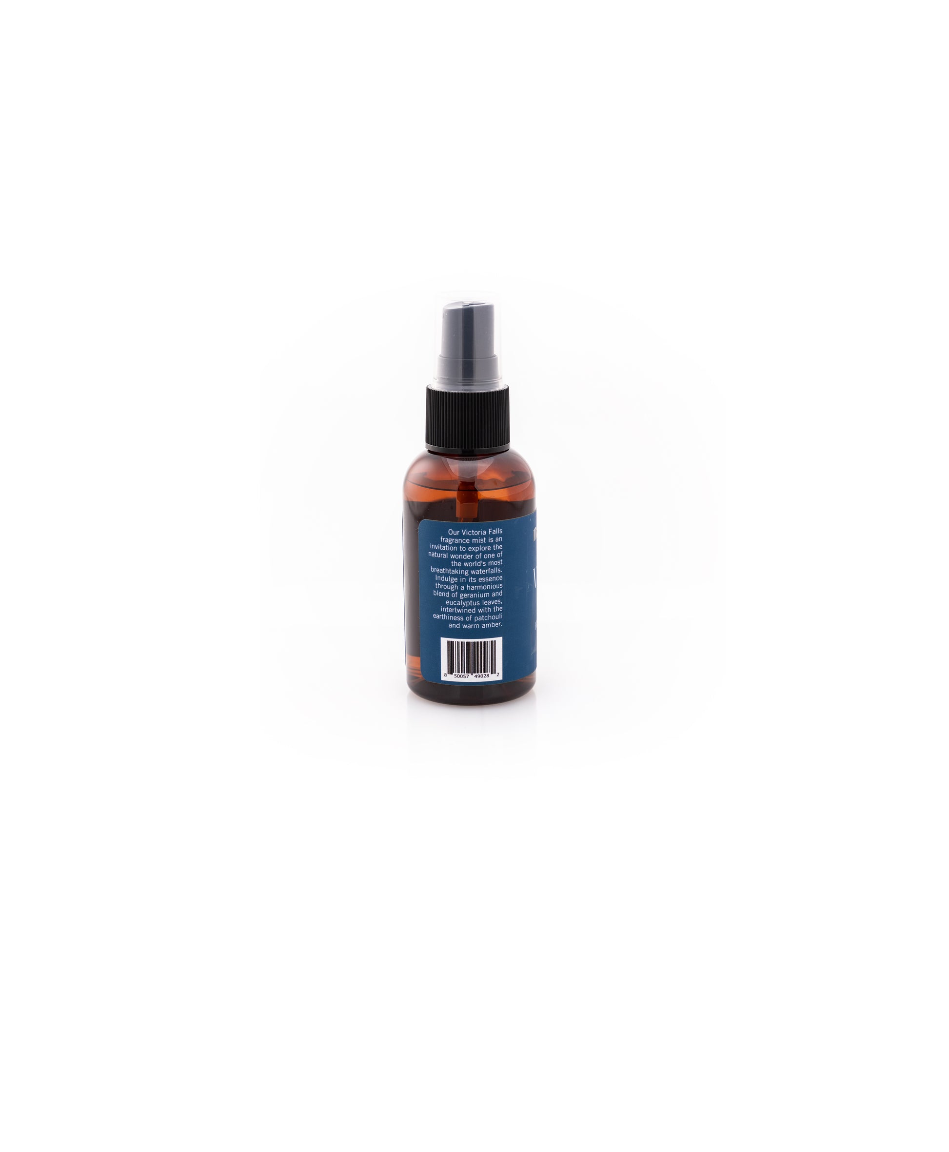 Victoria Falls Fragrance Mist Bottle Description, which reads: Our Victoria Falls fragrance mist is an invitation to explore the natural wonder of one of the world's most breathtaking waterfalls. Indulge in its essence through a harmonious blend of geranium and eucalyptus leaves, intertwined with the earthiness of patchouli and warm amber.